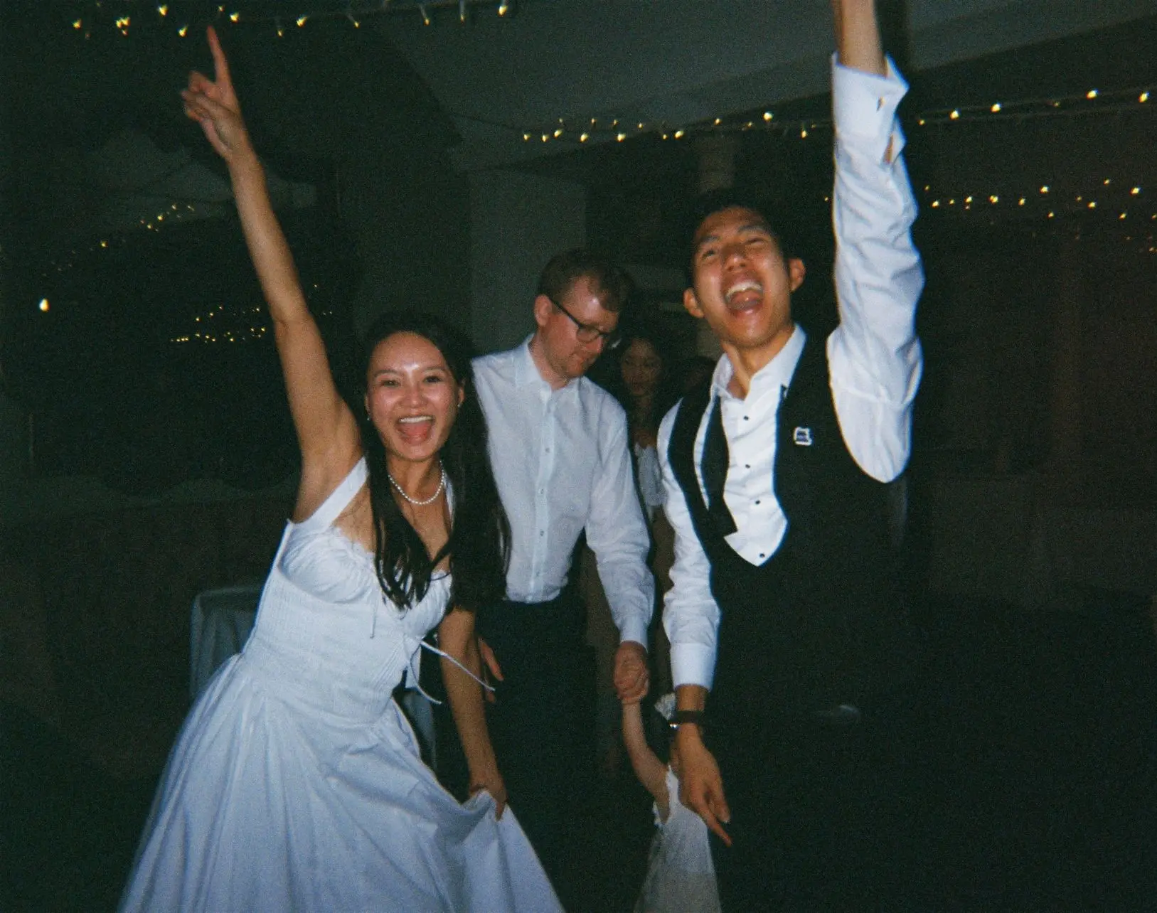 Cropped 35mm film photo of bride and groom dancing